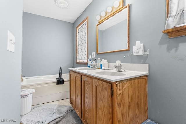 5869 Beechwood Ave, Alliance, OH 44601 - bathroom featuring double vanity and a bath