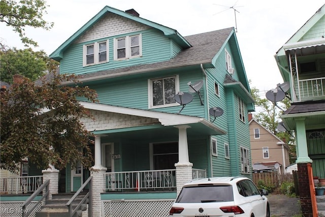 13413 Graham Rd, East Cleveland, OH 44112 - view of front of home featuring a porch and a shingled roof