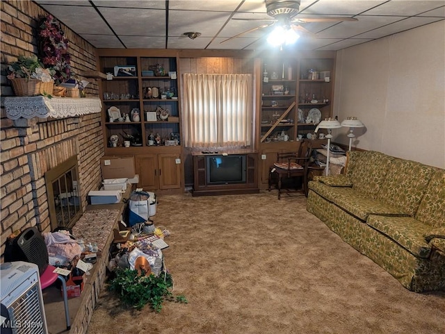115 SW Spring St, Gnadenhutten, OH 44629 - carpeted living area featuring a fireplace and ceiling fan