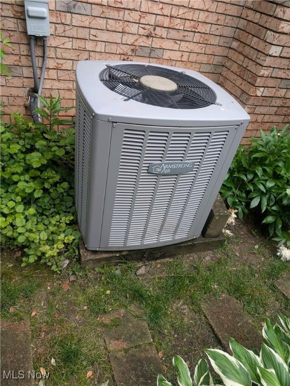 115 SW Spring St, Gnadenhutten, OH 44629 - exterior view of cooling unit and brick siding