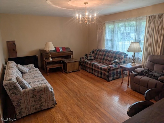 115 SW Spring St, Gnadenhutten, OH 44629 - living area featuring a chandelier and wood finished floors