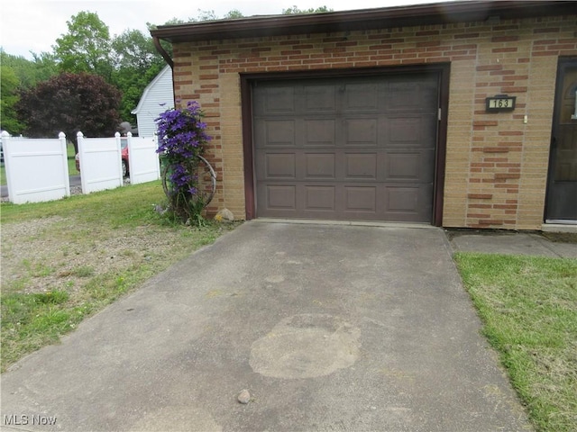 163 N Chestnut St, Linesville, PA 16424 - garage featuring concrete driveway