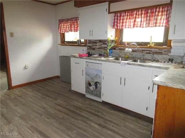 163 N Chestnut St, Linesville, PA 16424 - kitchen featuring dishwasher, a sink, backsplash, and white cabinets