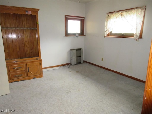 163 N Chestnut St, Linesville, PA 16424 - unfurnished bedroom with radiator, carpet flooring, and baseboards
