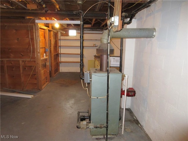 163 N Chestnut St, Linesville, PA 16424 - unfinished basement featuring a heating unit