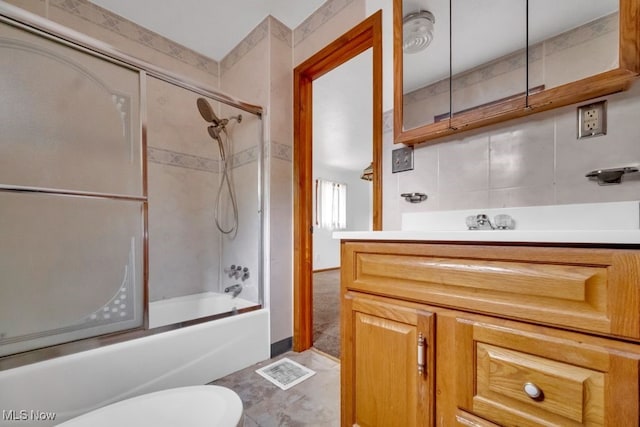 1586 E 86th St, Cleveland, OH 44106 - bathroom with vanity, shower / bath combination with glass door, and toilet