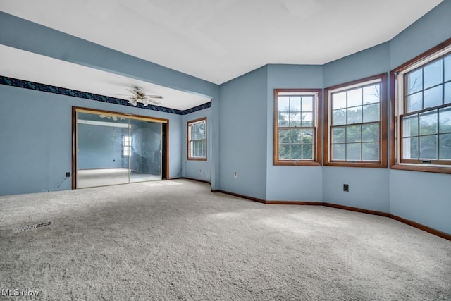 1586 E 86th St, Cleveland, OH 44106 - carpeted empty room with baseboards and ceiling fan