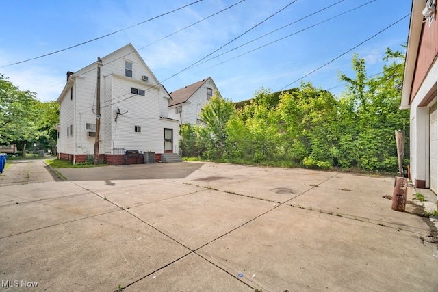 1586 E 86th St, Cleveland, OH 44106 - view of side of home featuring entry steps