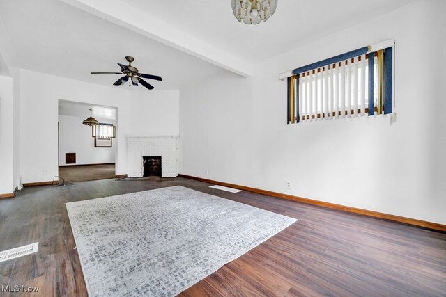 1586 E 86th St, Cleveland, OH 44106 - living area with baseboards, dark wood-type flooring, ceiling fan, and a fireplace