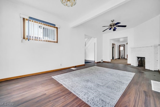 1586 E 86th St, Cleveland, OH 44106 - living area featuring dark wood-style floors, baseboards, healthy amount of natural light, a ceiling fan, and beamed ceiling
