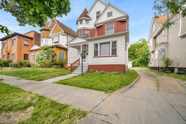 1586 E 86th St, Cleveland, OH 44106 - view of front of house featuring a front lawn