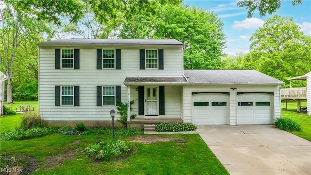10114 Pirates Trl, Reminderville, OH 44202 - view of front facade featuring a garage, driveway, and a front lawn