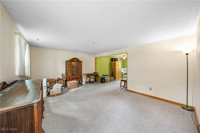 10114 Pirates Trl, Reminderville, OH 44202 - carpeted living area with ceiling fan and baseboards