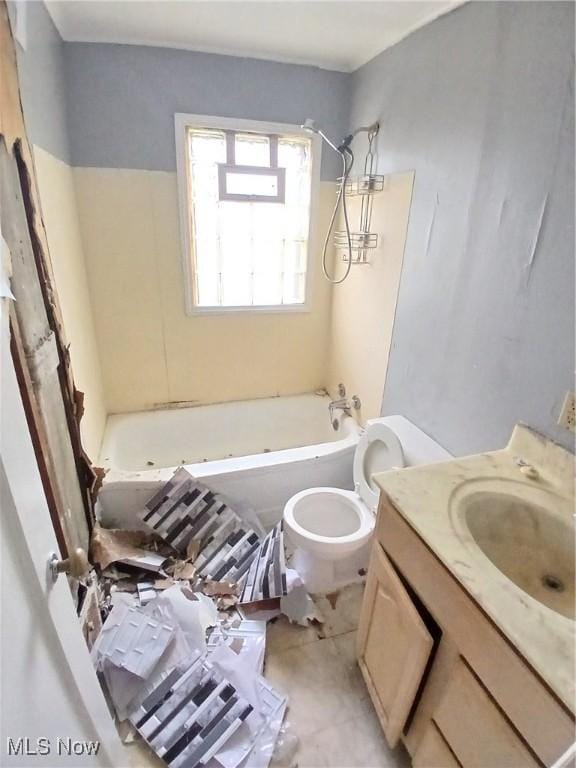 702 Hall St NW, Warren, OH 44483 - bathroom featuring toilet, vanity, and washtub / shower combination