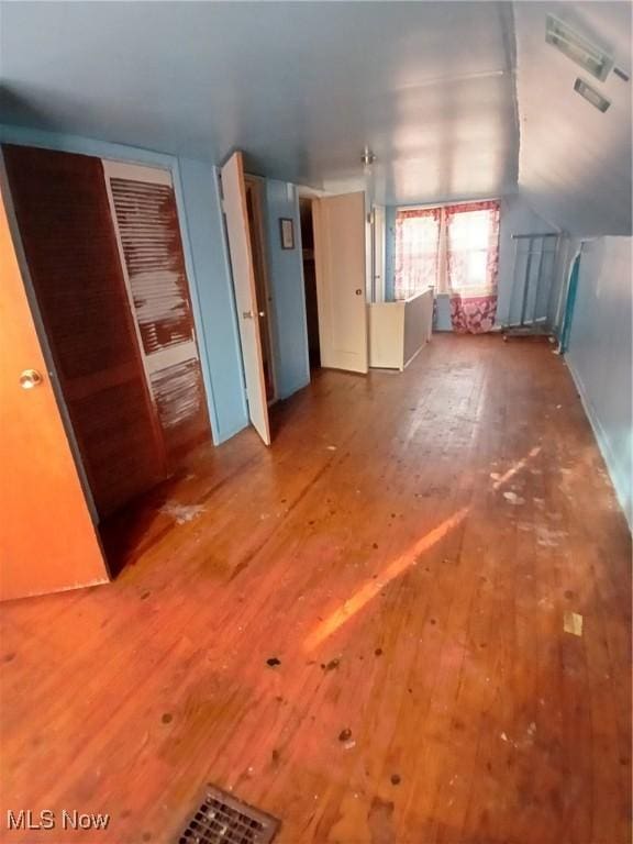 702 Hall St NW, Warren, OH 44483 - unfurnished room with hardwood / wood-style floors and lofted ceiling