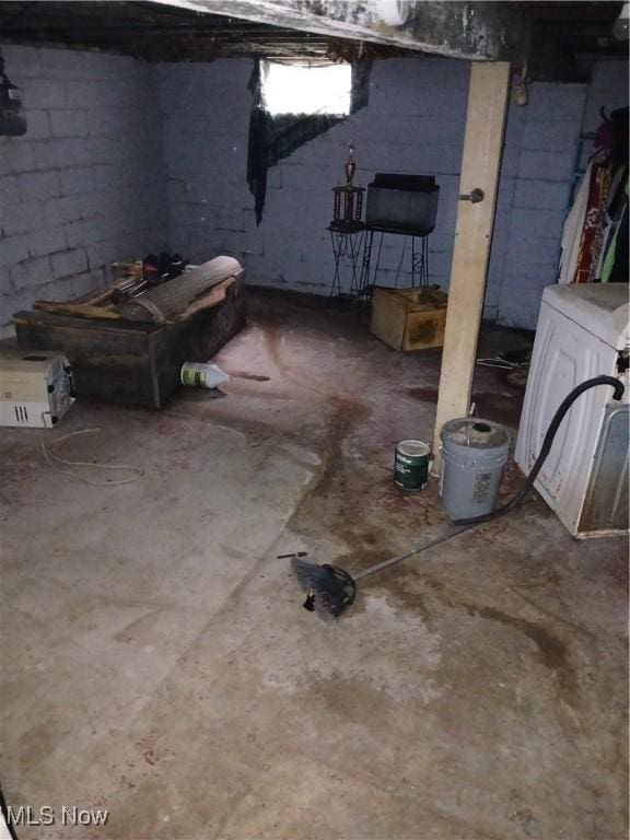 702 Hall St NW, Warren, OH 44483 - unfinished basement featuring washer / clothes dryer