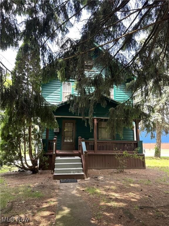611 Forest St NE, Warren, OH 44483 - obstructed view of property with covered porch