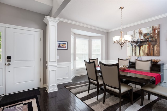 3413 Stillwood Blvd, Stow, OH 44224 - dining area featuring decorative columns, dark wood-style floors, crown molding, wainscoting, and a chandelier