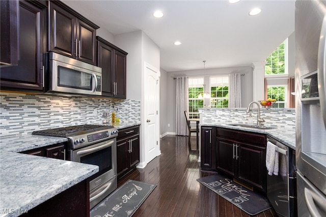 3413 Stillwood Blvd, Stow, OH 44224 - kitchen featuring appliances with stainless steel finishes, a sink, backsplash, light stone countertops, and recessed lighting