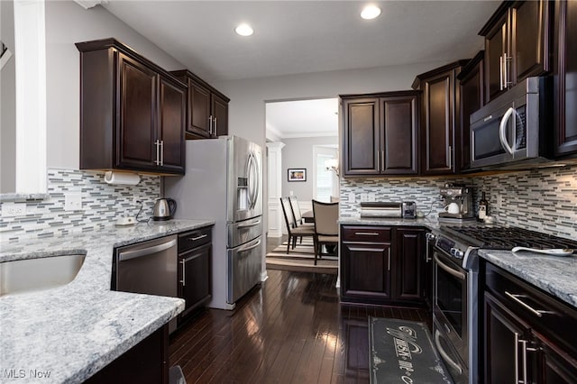 3413 Stillwood Blvd, Stow, OH 44224 - kitchen with appliances with stainless steel finishes, dark brown cabinetry, crown molding, recessed lighting, and dark wood-style flooring