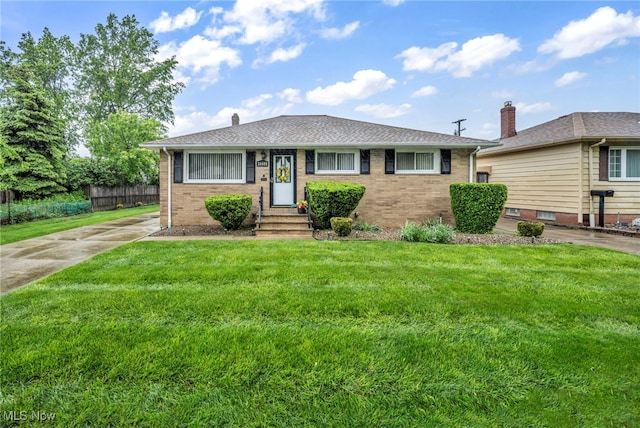 26601 Leslie Ave, Euclid, OH 44132 - view of front facade featuring brick siding, a chimney, entry steps, and roof with shingles