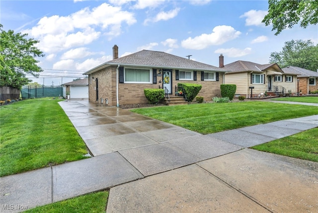 26601 Leslie Ave, Euclid, OH 44132 - ranch-style house featuring brick siding, a chimney, a garage, and an outdoor structure