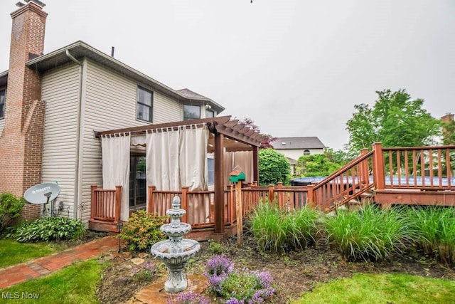 2410 Rohrer St NW, North Canton, OH 44720 - back of property with a chimney and a deck
