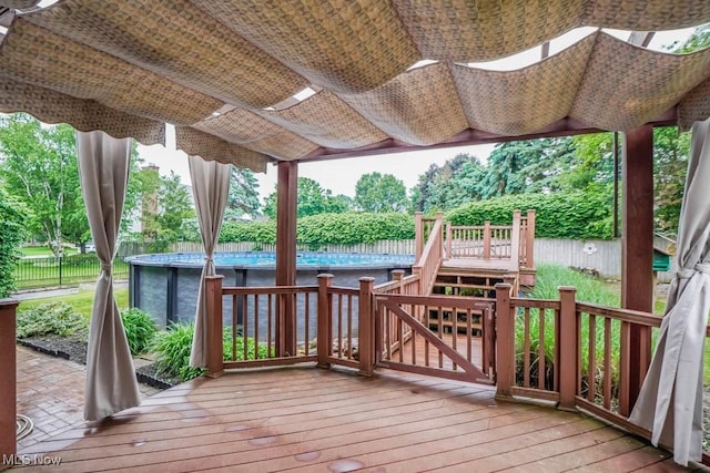 2410 Rohrer St NW, North Canton, OH 44720 - wooden terrace featuring a fenced backyard and stairs