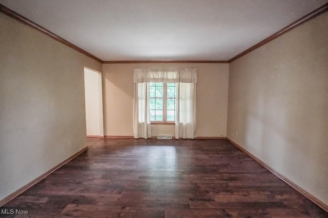 2410 Rohrer St NW, North Canton, OH 44720 - unfurnished room featuring wood finished floors, crown molding, and baseboards