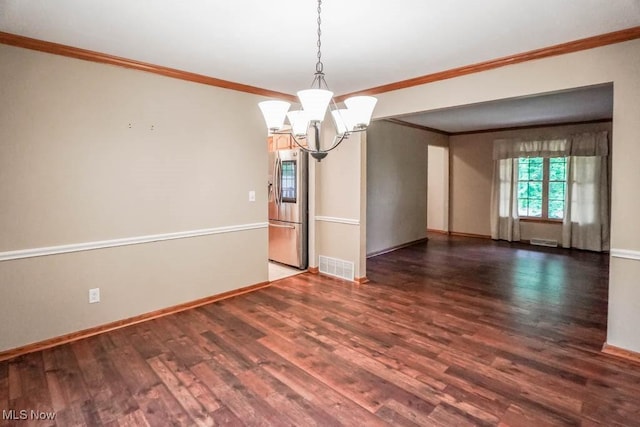 2410 Rohrer St NW, North Canton, OH 44720 - unfurnished room with a chandelier, ornamental molding, wood finished floors, and baseboards