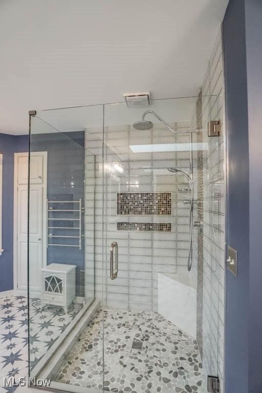 2410 Rohrer St NW, North Canton, OH 44720 - bathroom with a stall shower and tile patterned floors