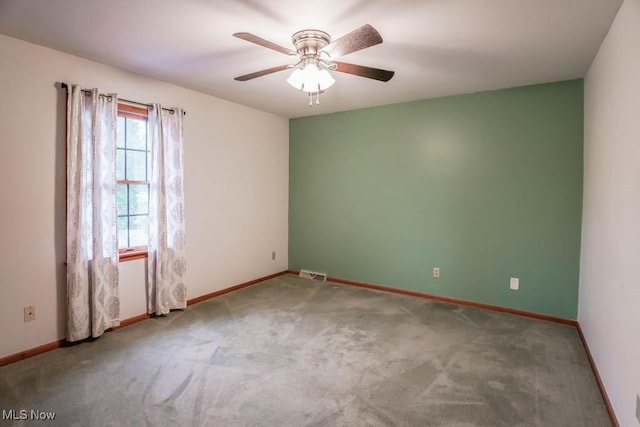 2410 Rohrer St NW, North Canton, OH 44720 - carpeted empty room with a ceiling fan and baseboards