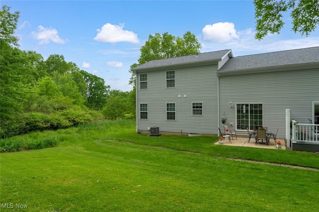 1441 Shaw Ave Unit A, Niles, OH 44446 - rear view of house featuring central air condition unit, a patio area, and a lawn