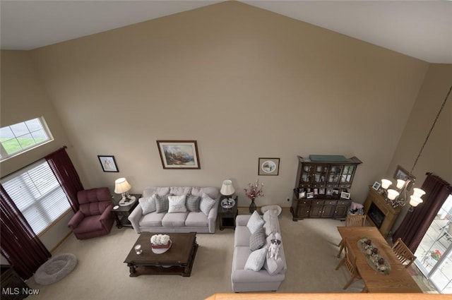 1441 Shaw Ave Unit A, Niles, OH 44446 - carpeted living area featuring high vaulted ceiling and a glass covered fireplace