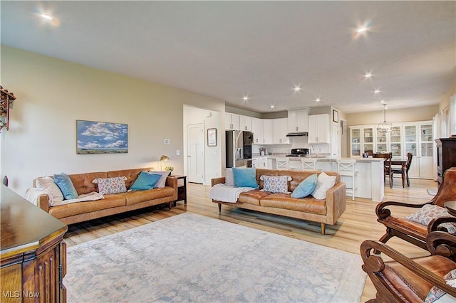 1572 Gate House St NE, Canton, OH 44721 - living area with light wood-style floors and recessed lighting