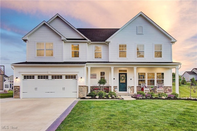 1572 Gate House St NE, Canton, OH 44721 - view of front facade with covered porch, stone siding, a yard, and a garage