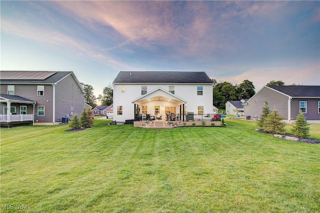 1572 Gate House St NE, Canton, OH 44721 - rear view of house with a patio, cooling unit, a lawn, and a ceiling fan