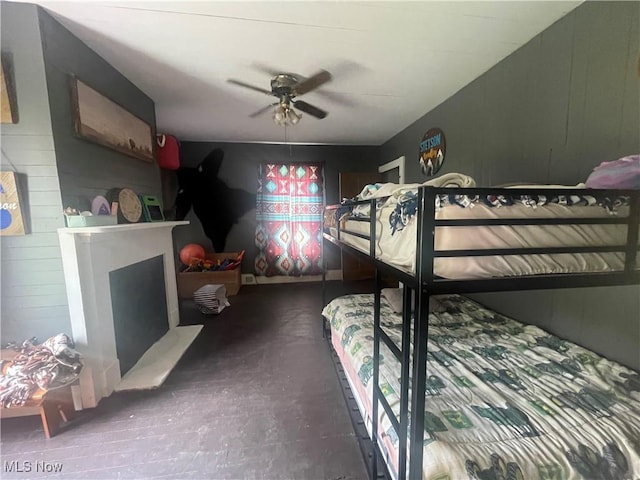 2743 Cow Creek Rd, Saint Marys, WV 26170 - bedroom with wood walls, a fireplace, and ceiling fan