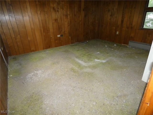 52100 State Route 536, Hannibal, OH 43915 - spare room with baseboard heating and wood walls