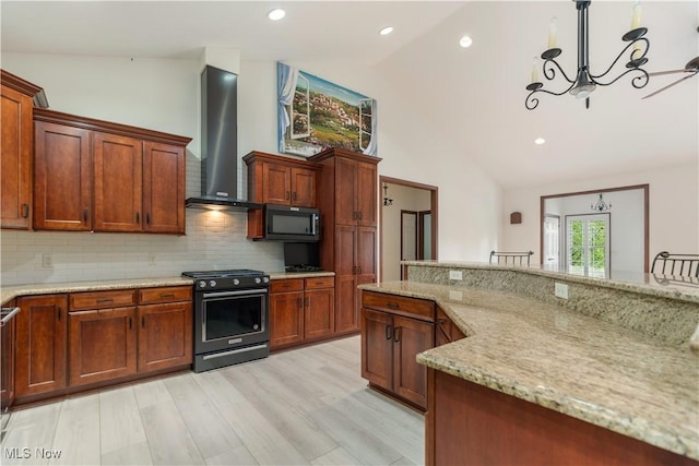 4953 Maclaren Ave NW, Massillon, OH 44646 - kitchen with gas range, wall chimney range hood, black microwave, tasteful backsplash, and a chandelier
