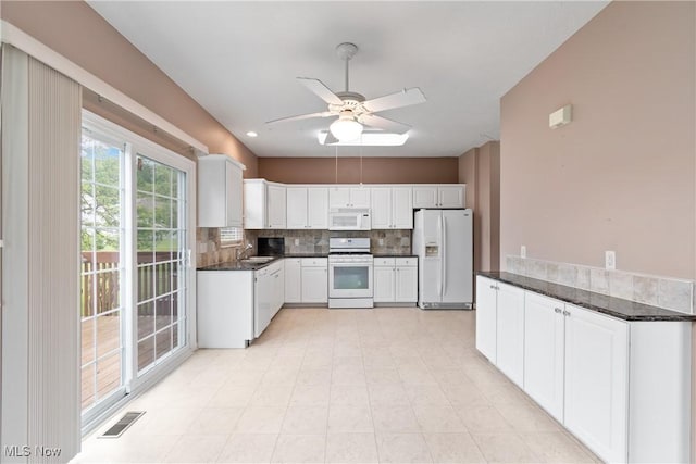 7284 Forest Cove Ln, Northfield, OH 44067 - kitchen featuring white appliances, a sink, ceiling fan, backsplash, and white cabinets