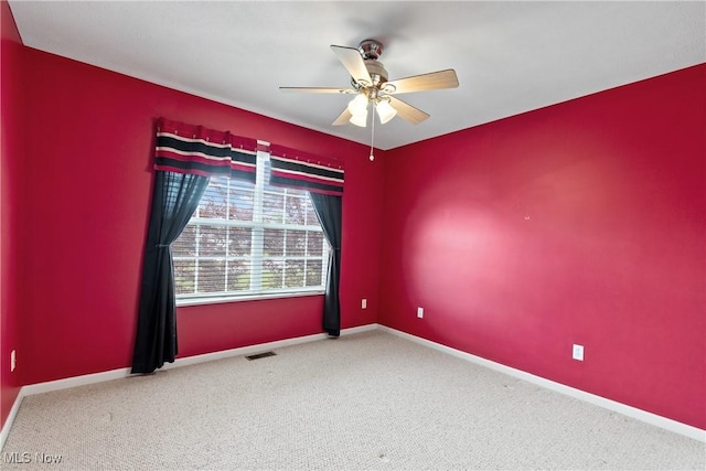 7284 Forest Cove Ln, Northfield, OH 44067 - spare room with a ceiling fan, carpet flooring, and baseboards