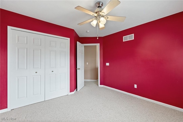 7284 Forest Cove Ln, Northfield, OH 44067 - unfurnished bedroom featuring carpet, a closet, baseboards, and a ceiling fan