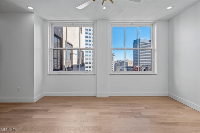 629 Euclid Ave Unit 1510, Cleveland, OH 44114 - empty room with light wood-style flooring, a ceiling fan, recessed lighting, and baseboards