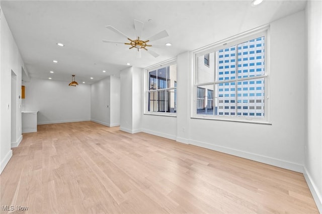 629 Euclid Ave Unit 1510, Cleveland, OH 44114 - unfurnished living room featuring recessed lighting, a ceiling fan, wood finished floors, and baseboards