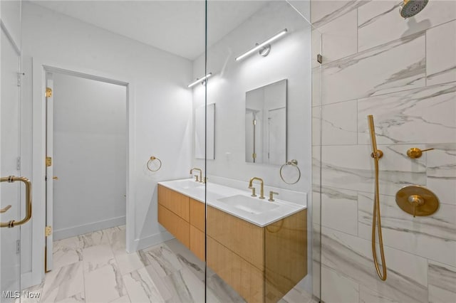 629 Euclid Ave Unit 1510, Cleveland, OH 44114 - bathroom featuring marble finish flooring, a marble finish shower, double vanity, and baseboards
