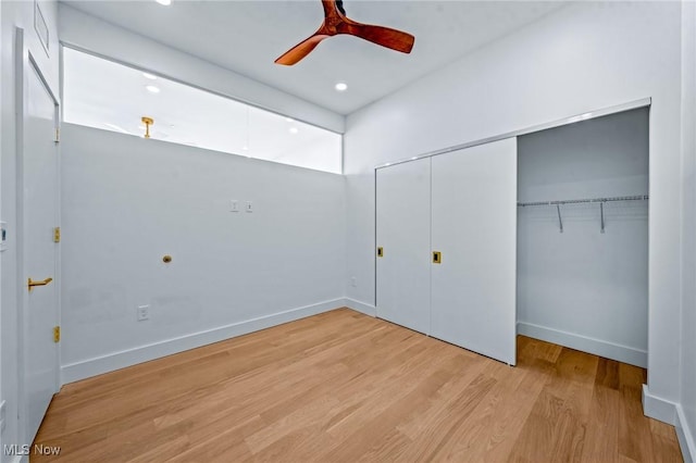 629 Euclid Ave Unit 1510, Cleveland, OH 44114 - unfurnished bedroom featuring a closet, wood finished floors, baseboards, a ceiling fan, and recessed lighting