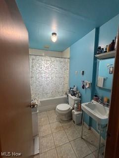 5806 Risher Rd, Leavittsburg, OH 44430 - full bathroom with toilet, shower / washtub combination, and a sink