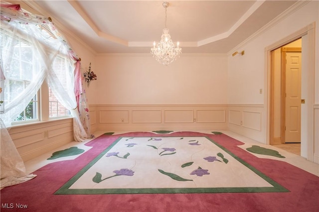 4219 Olde Charted Trl, Poland, OH 44514 - unfurnished bedroom with carpet flooring, a tray ceiling, a chandelier, wainscoting, and crown molding