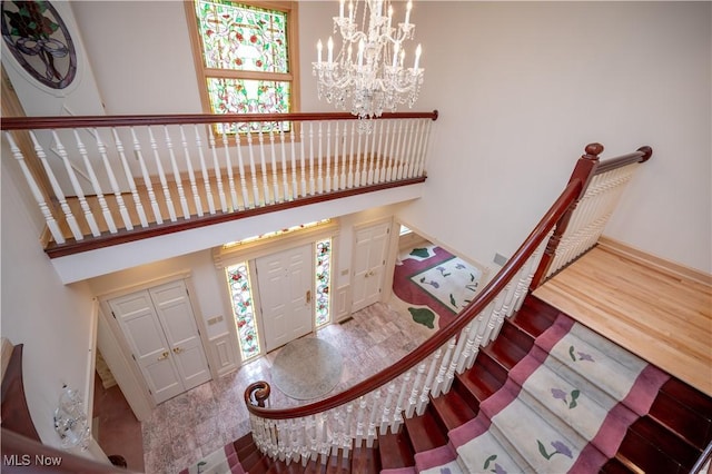 4219 Olde Charted Trl, Poland, OH 44514 - entrance foyer featuring a chandelier, healthy amount of natural light, and wood finished floors